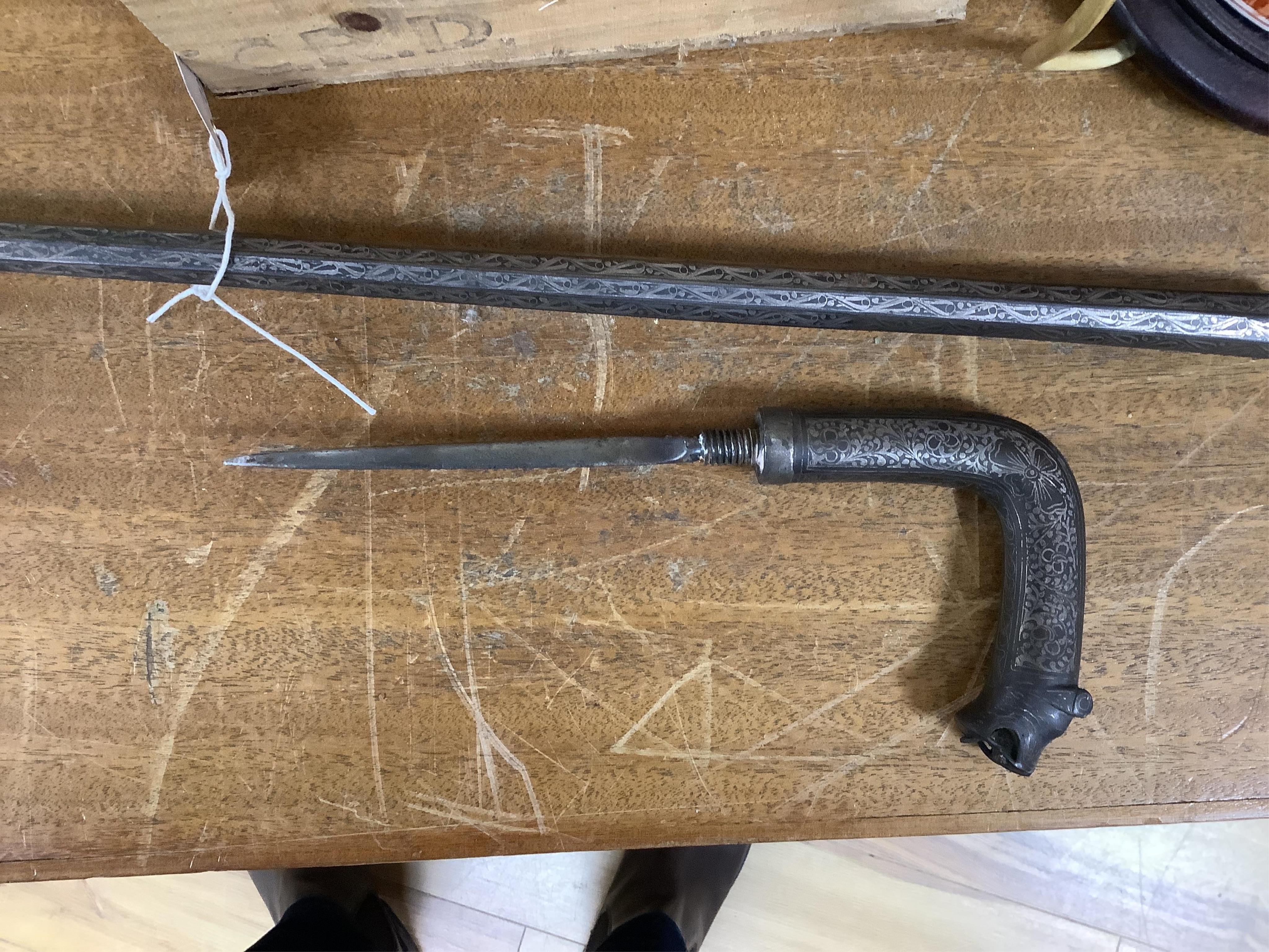 A 19th century Indian bidriware swordstick with stylised leopard handle, blade 14cm, overall length 97cm. Condition - fair to good, some surface wear.